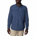 a man wearing a blue long sleeve shirt