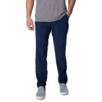a man wearing blue pants and grey shirt