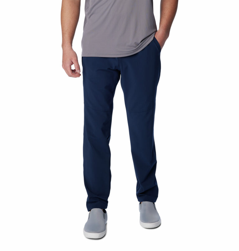 a man wearing blue pants and grey shirt