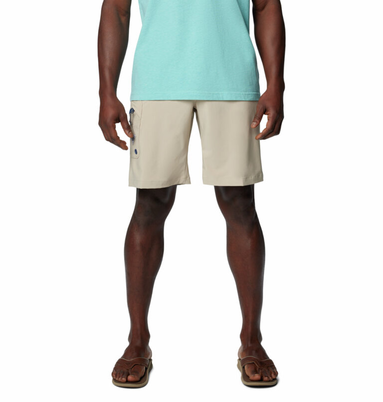 a man wearing PFG Terminal Tackle II shorts