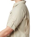 A close up of a Man in a brown shirt side view