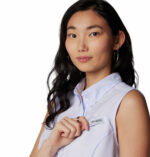 a woman with long hair wearing a white shirt