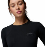a women wearing a black Midweight Stretch Long Sleeve Top