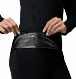 a women wearing a black Midweight Stretch Long Sleeve Top