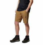 a man wearing shorts and black shirt
