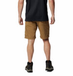 a man wearing shorts and black shirt