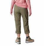a person wearing khaki pants and pink shirt