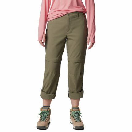 a person wearing khaki pants and pink shirt