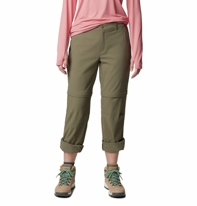 a person wearing khaki pants and pink shirt