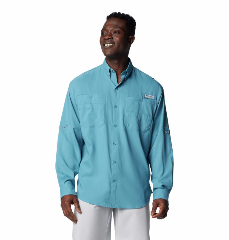 a man wearing a blue PFG Tamiami II Long Sleeve Shirt