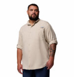 a man wearing a brown PFG Tamiami II Long Sleeve Shirt
