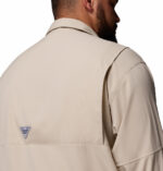 a man wearing a brown PFG Tamiami II Long Sleeve Shirt