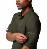 a man wearing a green silver ridge utility lite long sleeve shirt