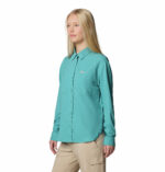 Women in blue long sleeve shirt side view