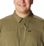 a man wearing a brown shirt