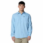 a man wearing a blue long sleeve shirt