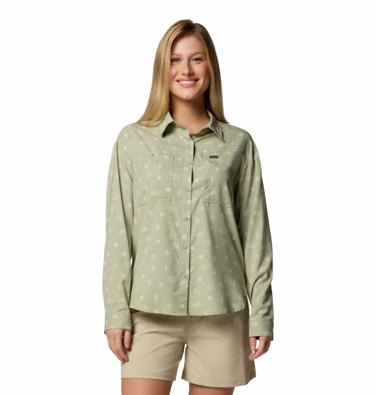 a women wearing a brown patterned long sleeve shirt