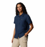 a women wearing a blue short sleeve shirt