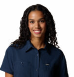a women wearing a blue short sleeve shirt