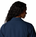 a women wearing a blue short sleeve shirt