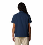 a women wearing a blue short sleeve shirt