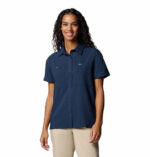 a women wearing a blue short sleeve shirt