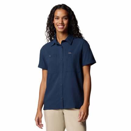 a women wearing a blue short sleeve shirt