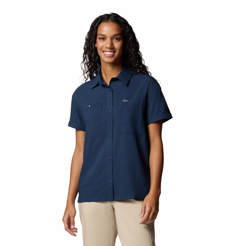 a women wearing a blue short sleeve shirt