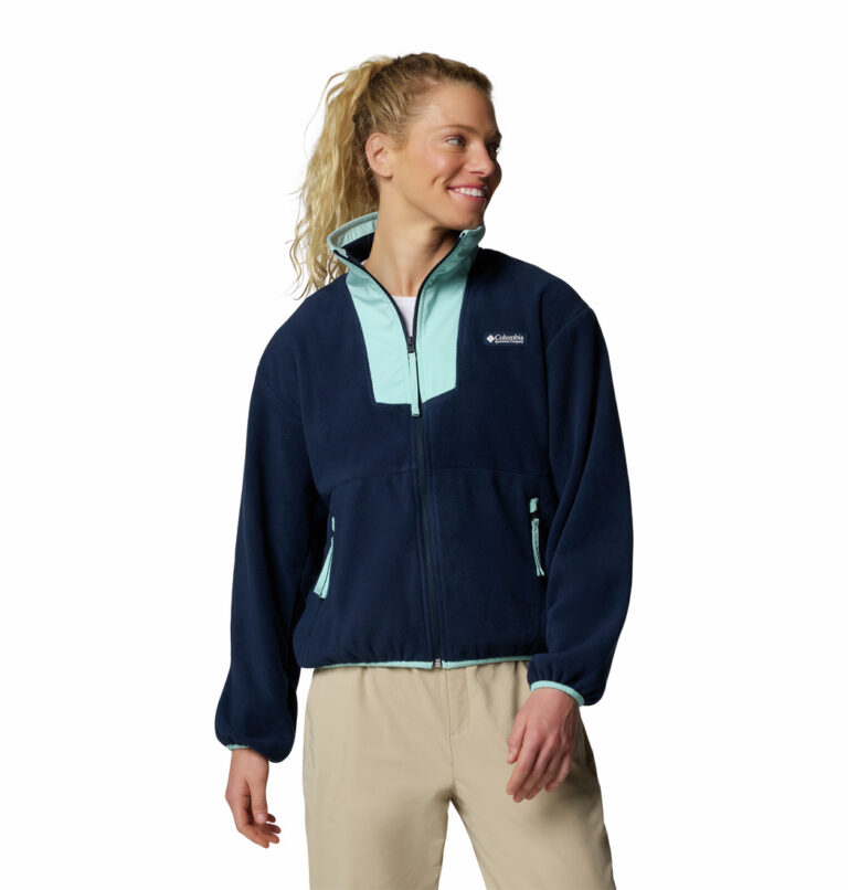 a women wearing a blue full zip fleece jacket