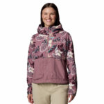 a women wearing a pink multi colour windbreaker jacket