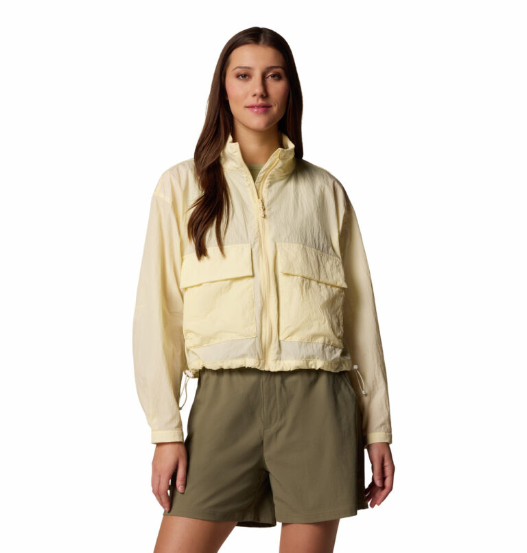 a women wearing a yellow windbreaker jacket