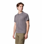 a man wearing a grey polo shirt