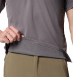 a man wearing a grey polo shirt
