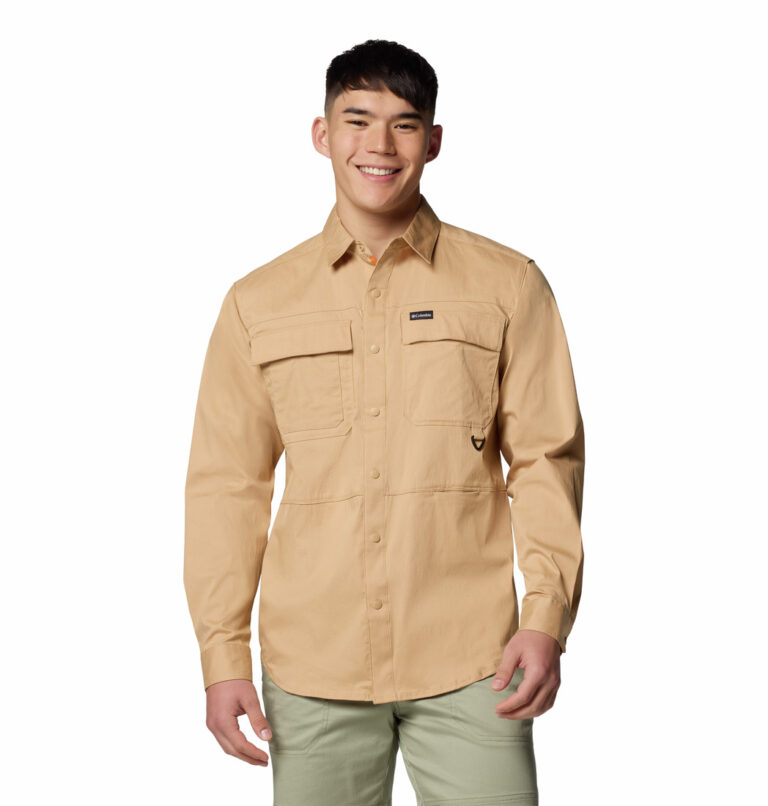 a man wearing a brown long sleeve shirt