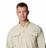 a man wearing a brown long sleeve shirt