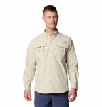 a man wearing a brown long sleeve shirt