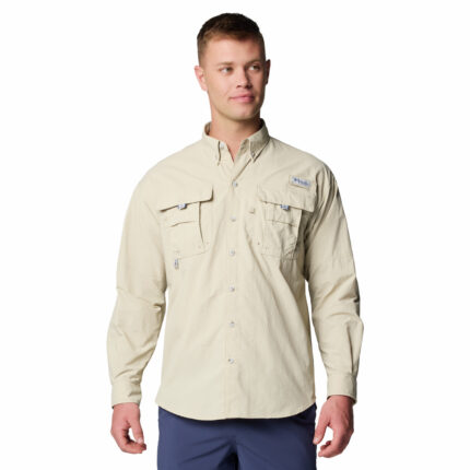 a man wearing a brown long sleeve shirt