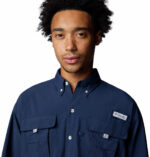 a man wearing a blue long sleeve shirt
