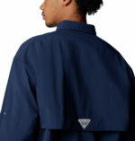 a man wearing a blue long sleeve shirt