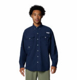 a man wearing a blue long sleeve shirt