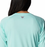 A women wearing a Blue long sleeve shirt