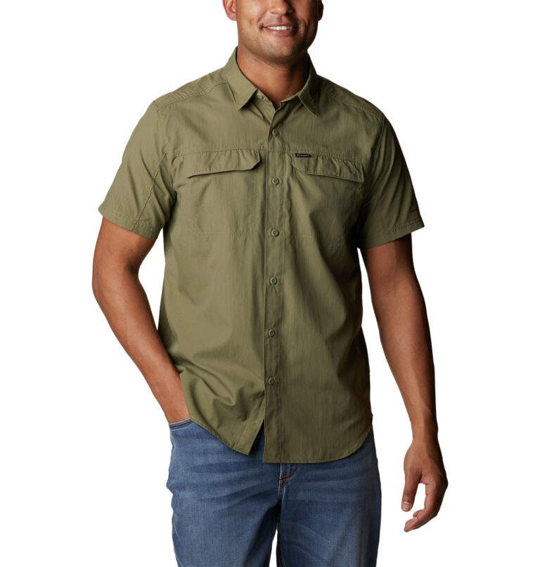 A man wearing a brown short sleeve shirt