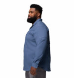 a man wearing a blue long sleeve shirt