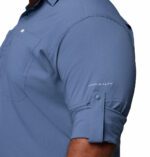 a man wearing a blue long sleeve shirt