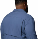 a man wearing a blue long sleeve shirt