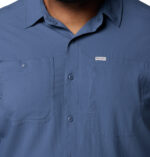 a man wearing a blue long sleeve shirt