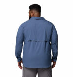 a man wearing a blue long sleeve shirt