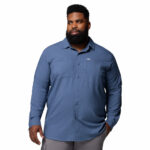 a man wearing a blue long sleeve shirt