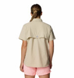 A women wearing a brown short sleeve shirt