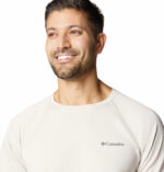 A man wearing a grey short sleeve shirt